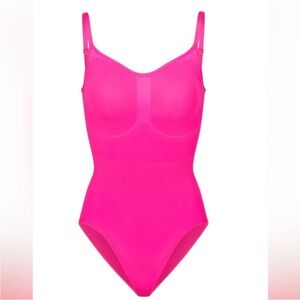 New in box Skims bodysuit in flamingo pink size L/XL. Limited edition.